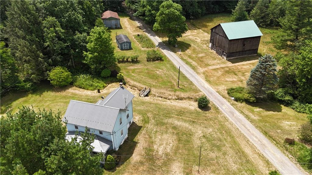 an aerial view of house with yard