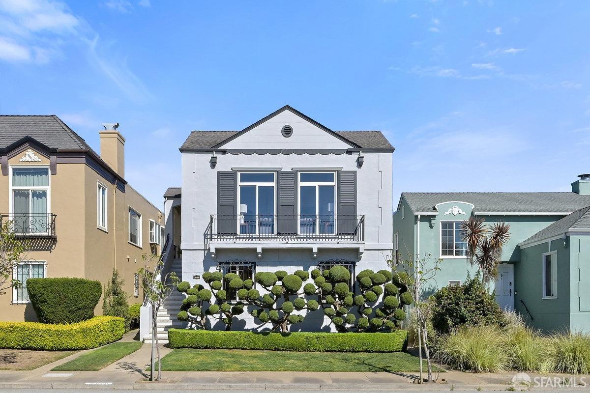 a front view of a house with garden