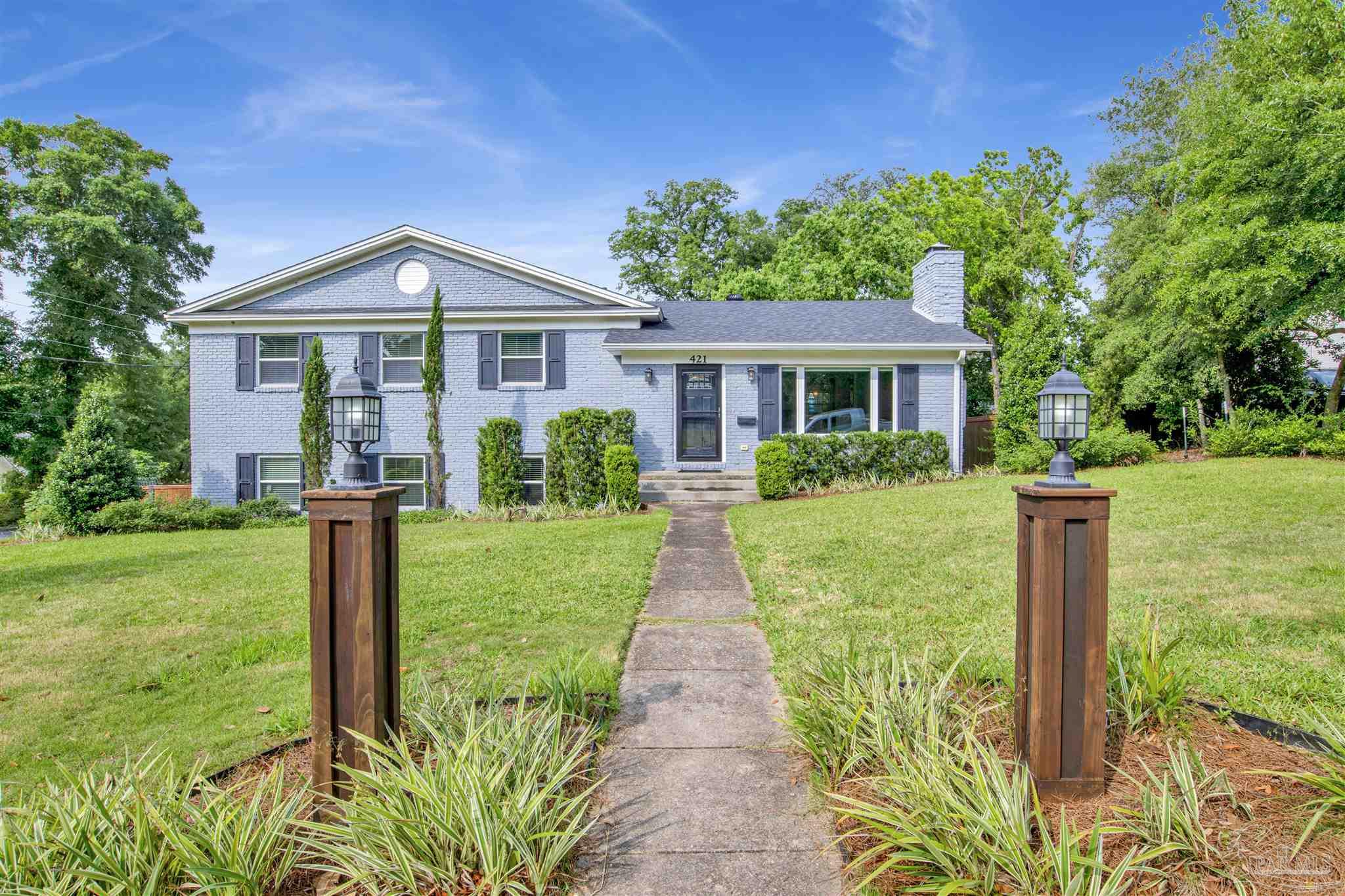 a front view of a house with a yard