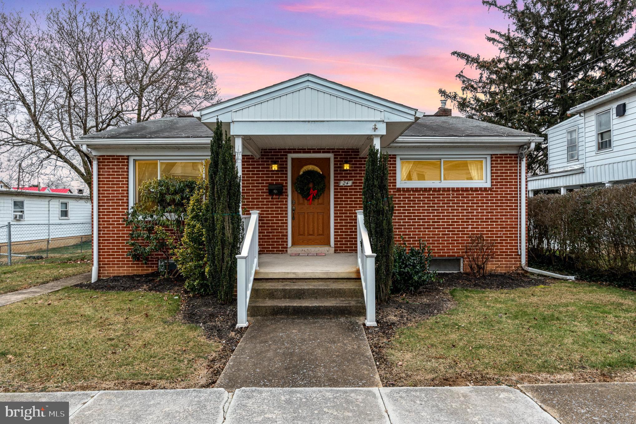 front view of a house with a yard