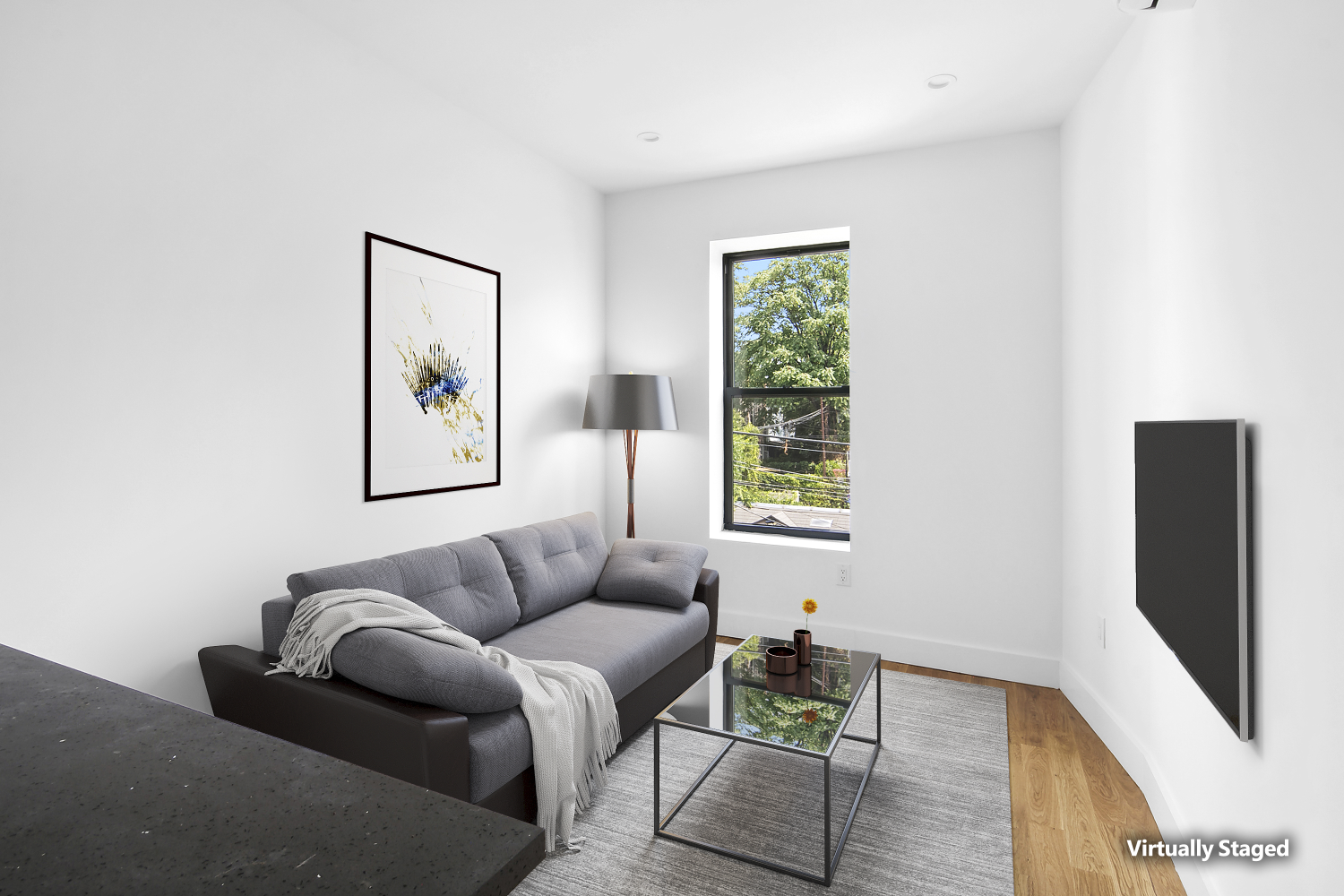 a living room with furniture and a flat screen tv