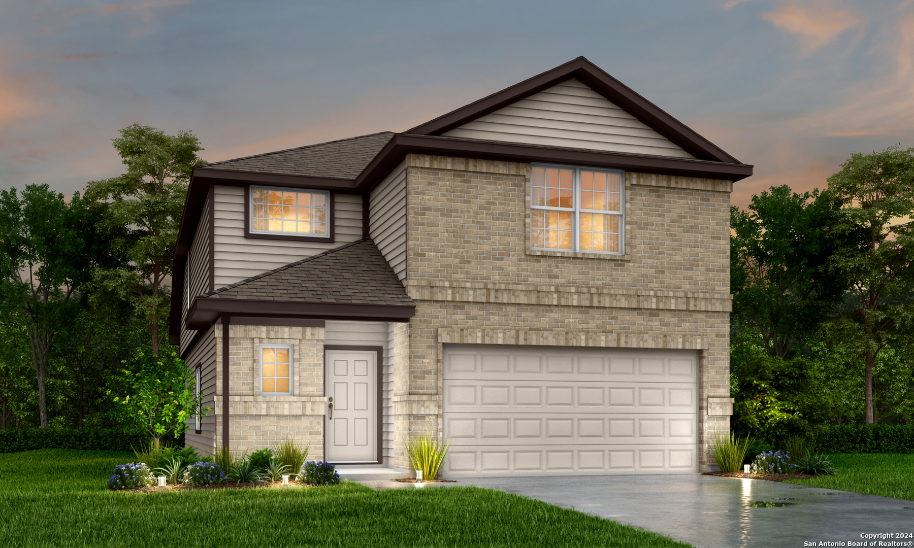 a front view of a house with a yard and garage