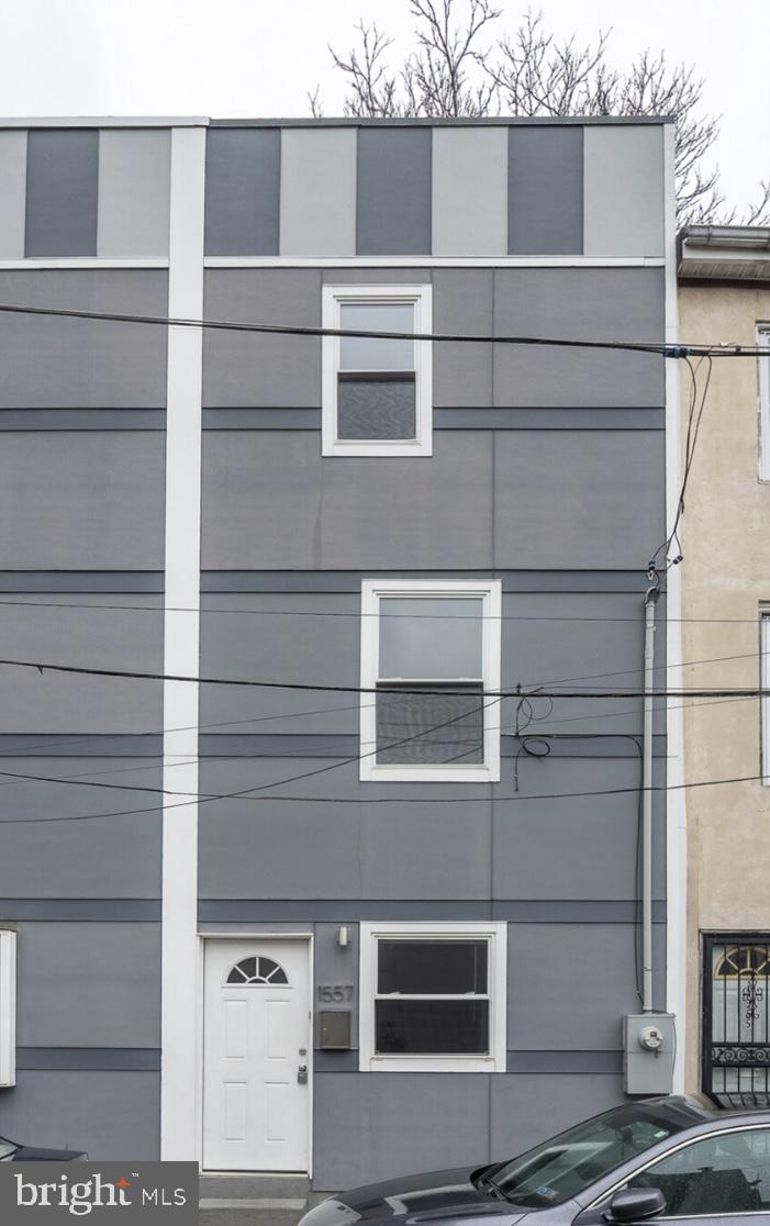 a view of a house with a door and a window