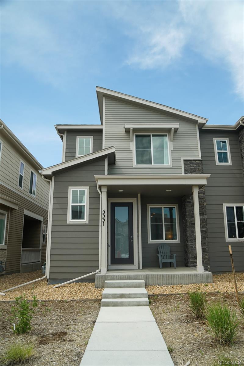 a front view of a house with yard