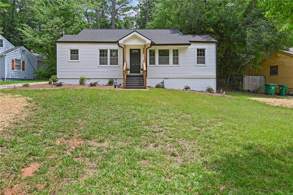 a front view of a house with a yard