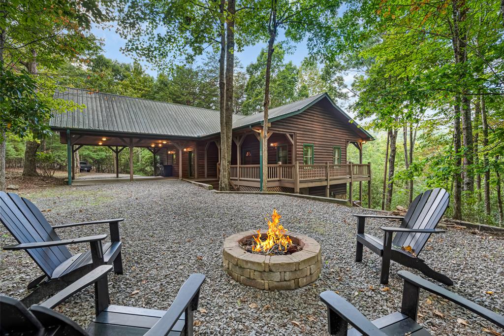 a backyard of a house with yard and outdoor seating