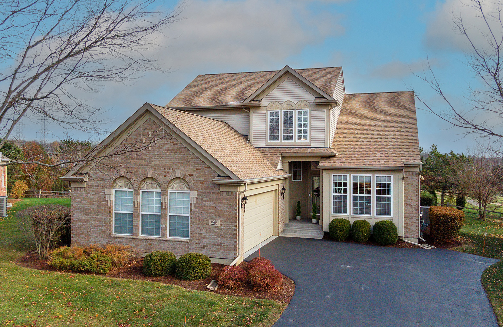 a front view of a house with a yard