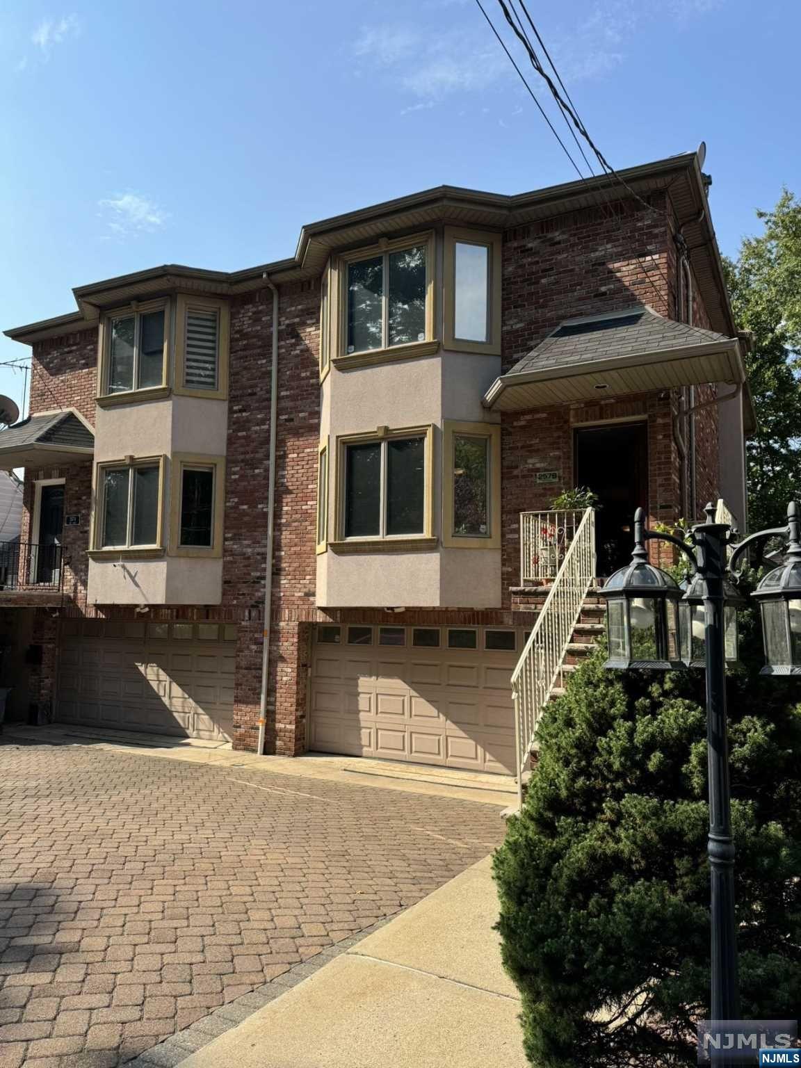 a front view of a house with garage