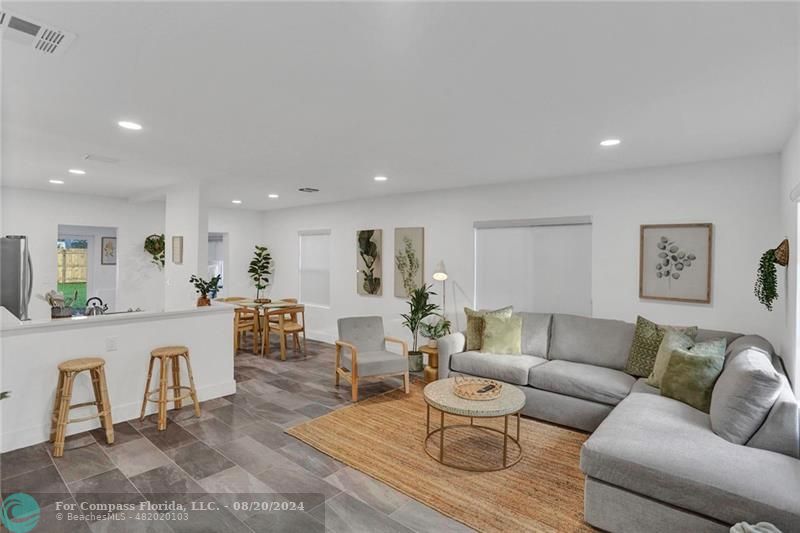 a view of a living room filled with furniture