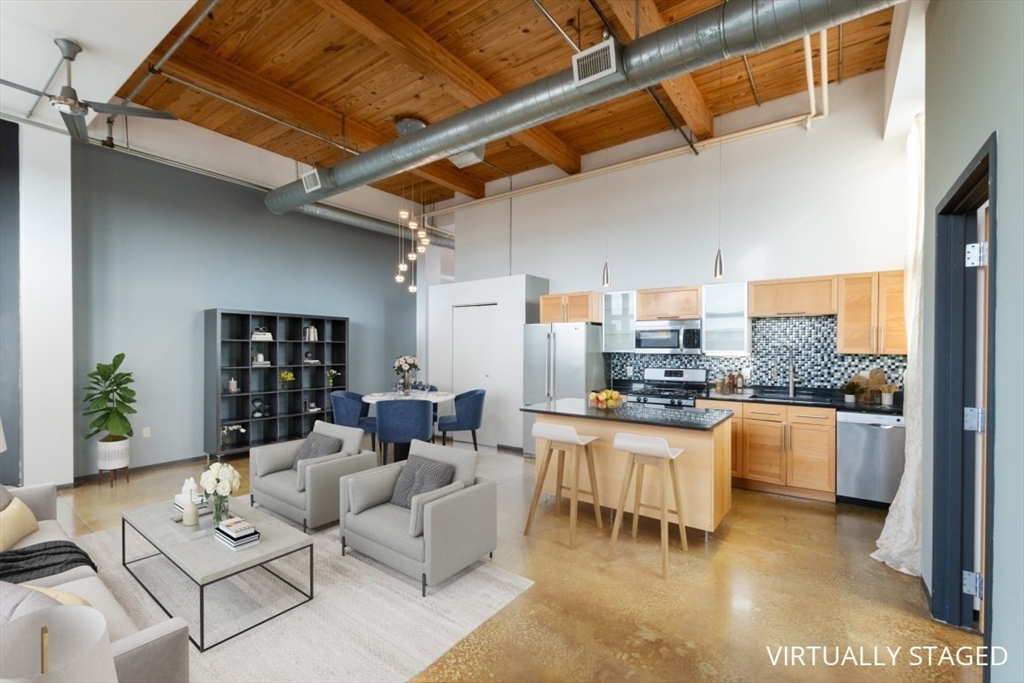 a living room with furniture and a table