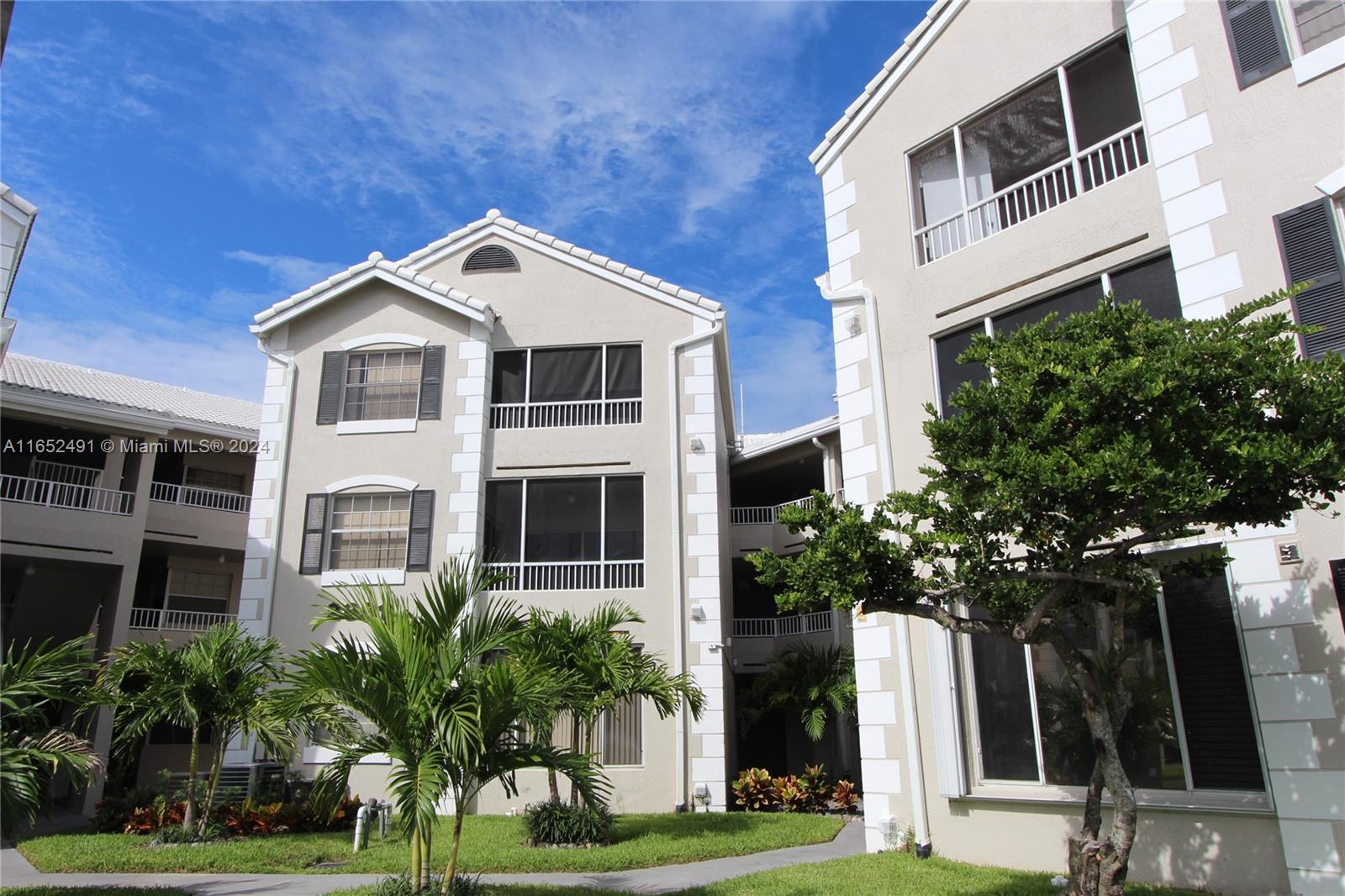 a front view of a house with yard