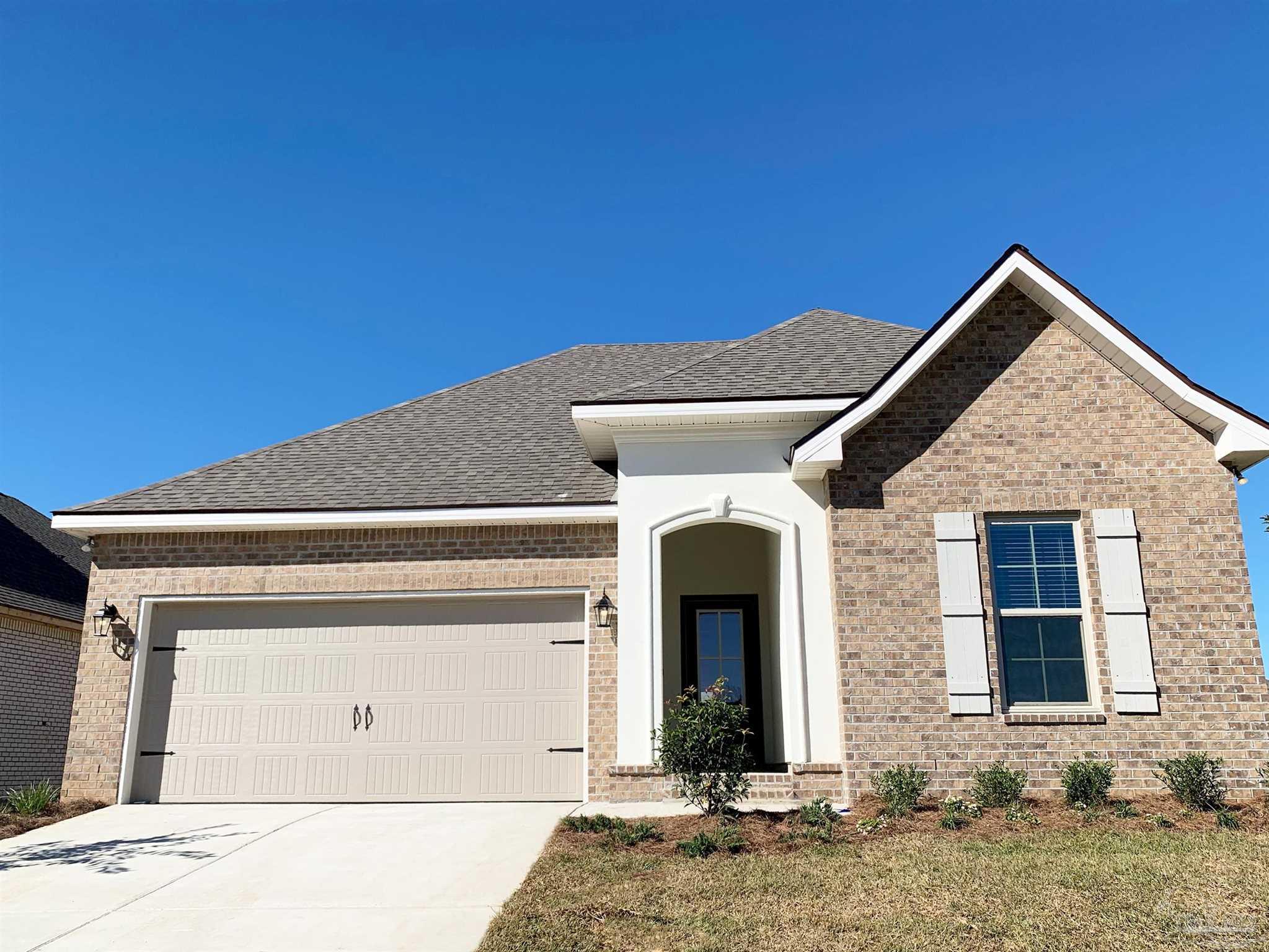 a front view of a house with a garage