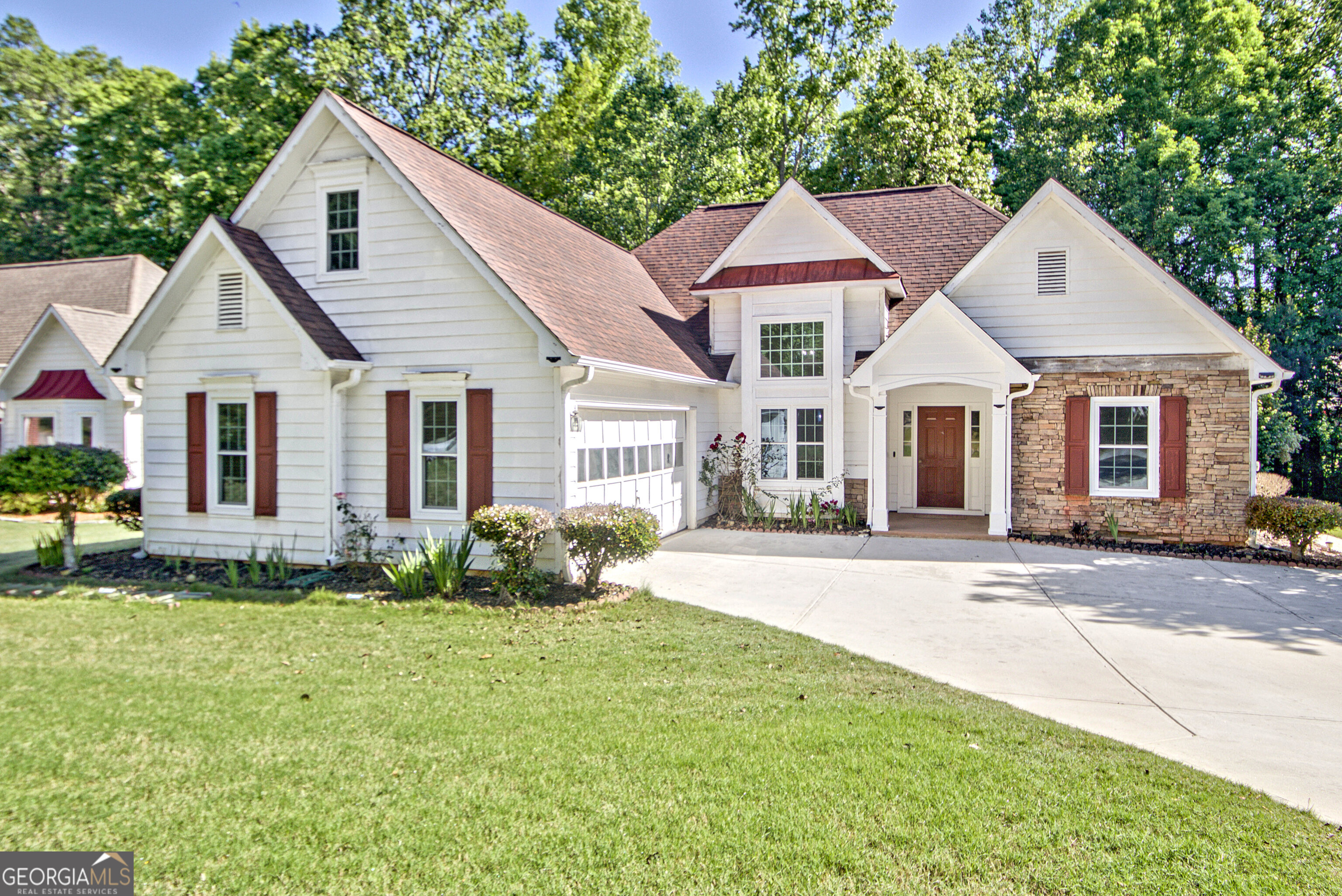 a front view of a house with a yard