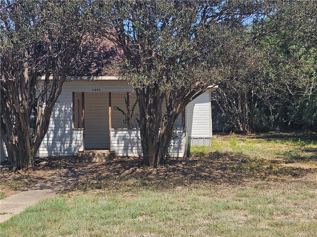 a house with trees in the background