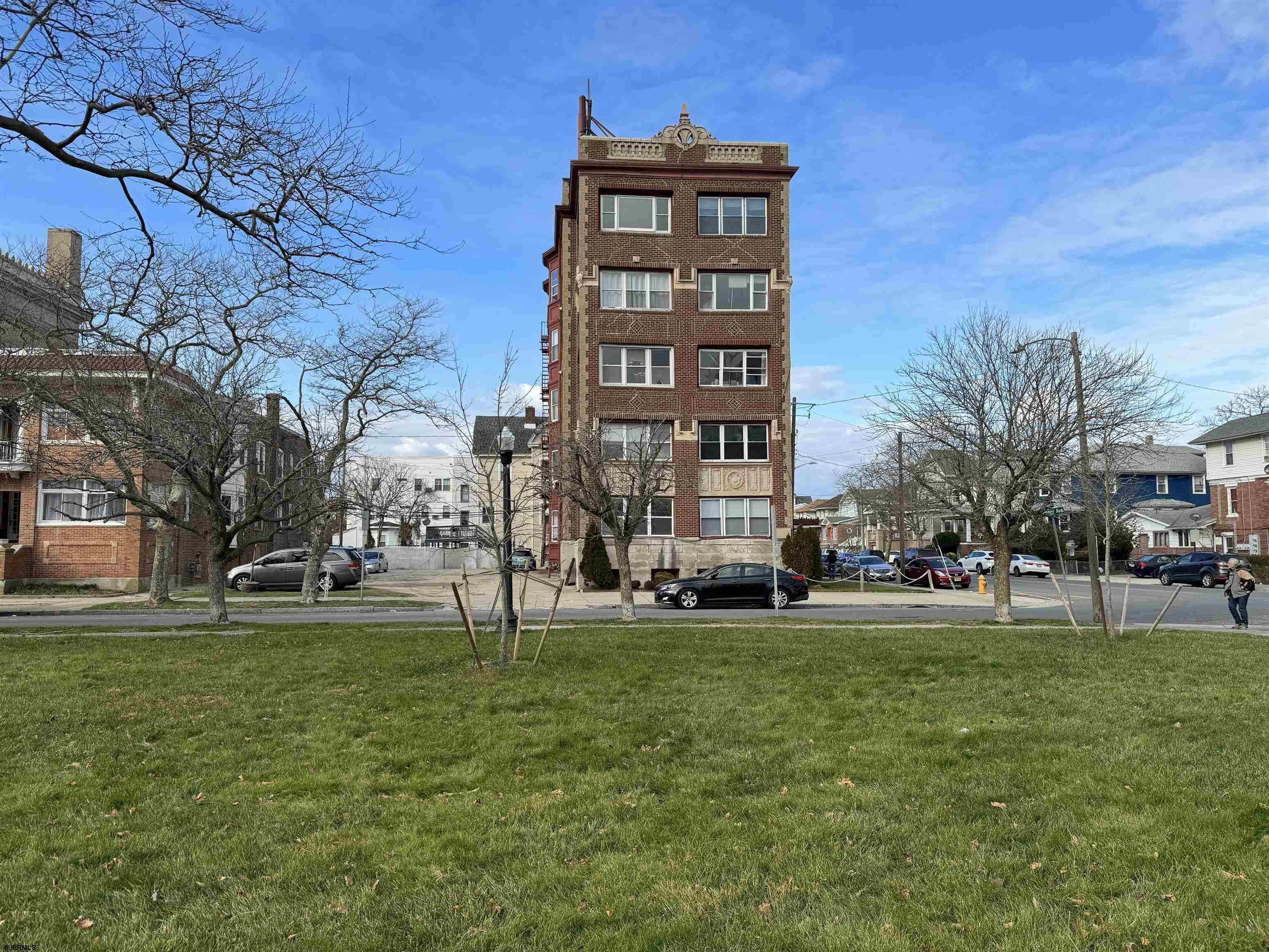 a view of a building with a yard