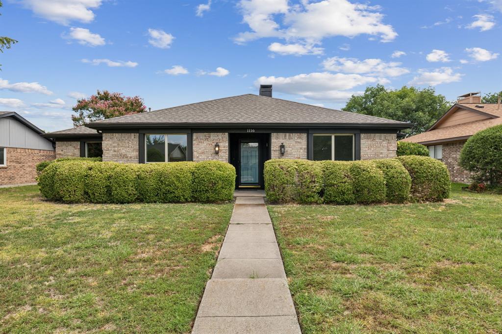 a front view of a house with yard