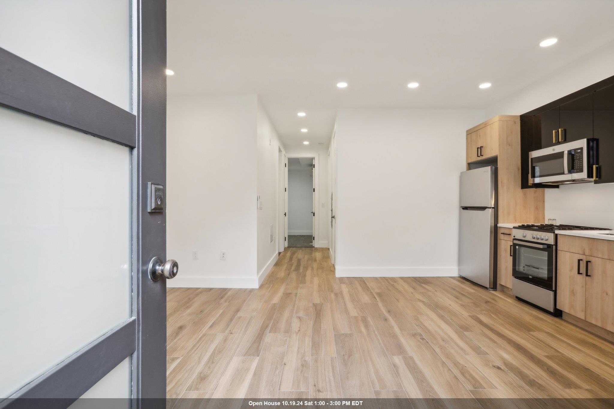 a view of a kitchen from the hallway