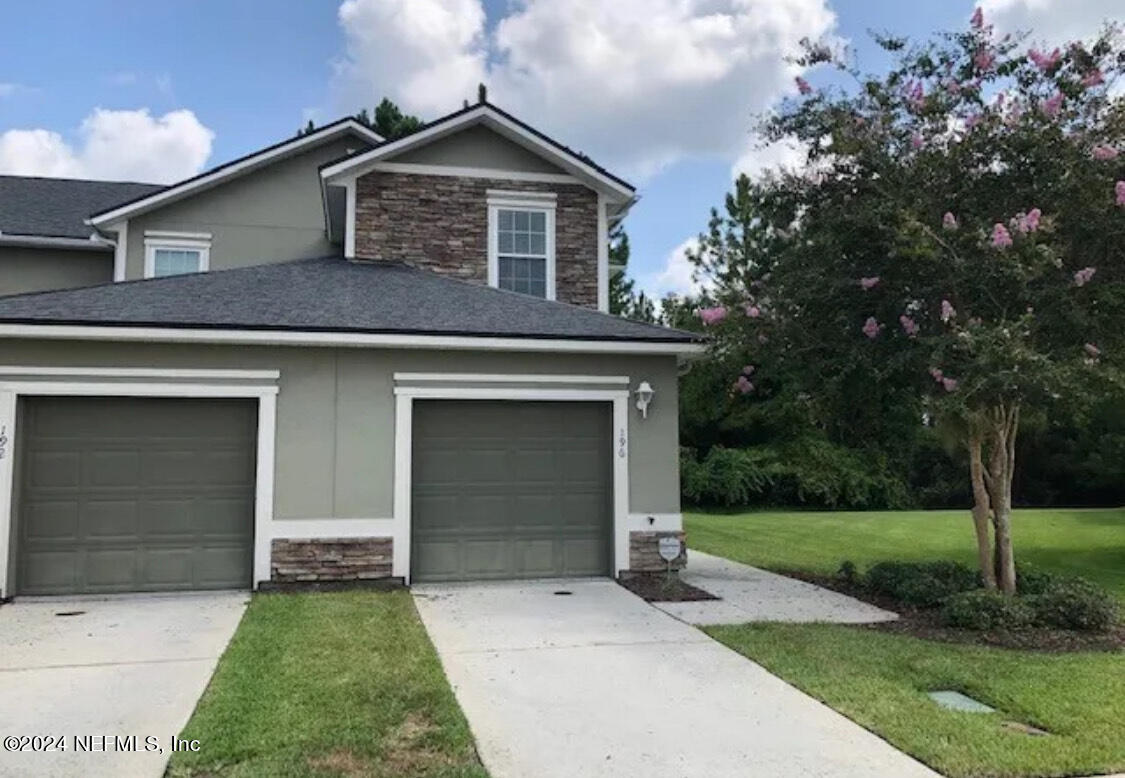 front view of a house with a yard