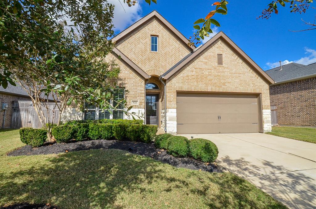 Blue skies above and manicured landscaping below shine down on this wonderful single family, single story brick treasure at 4526 Jennings Creek Court, Fulshear, TX, in the Brooks At Cross Creek community.