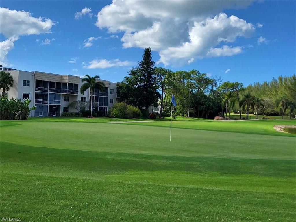 a view of a golf course of a house