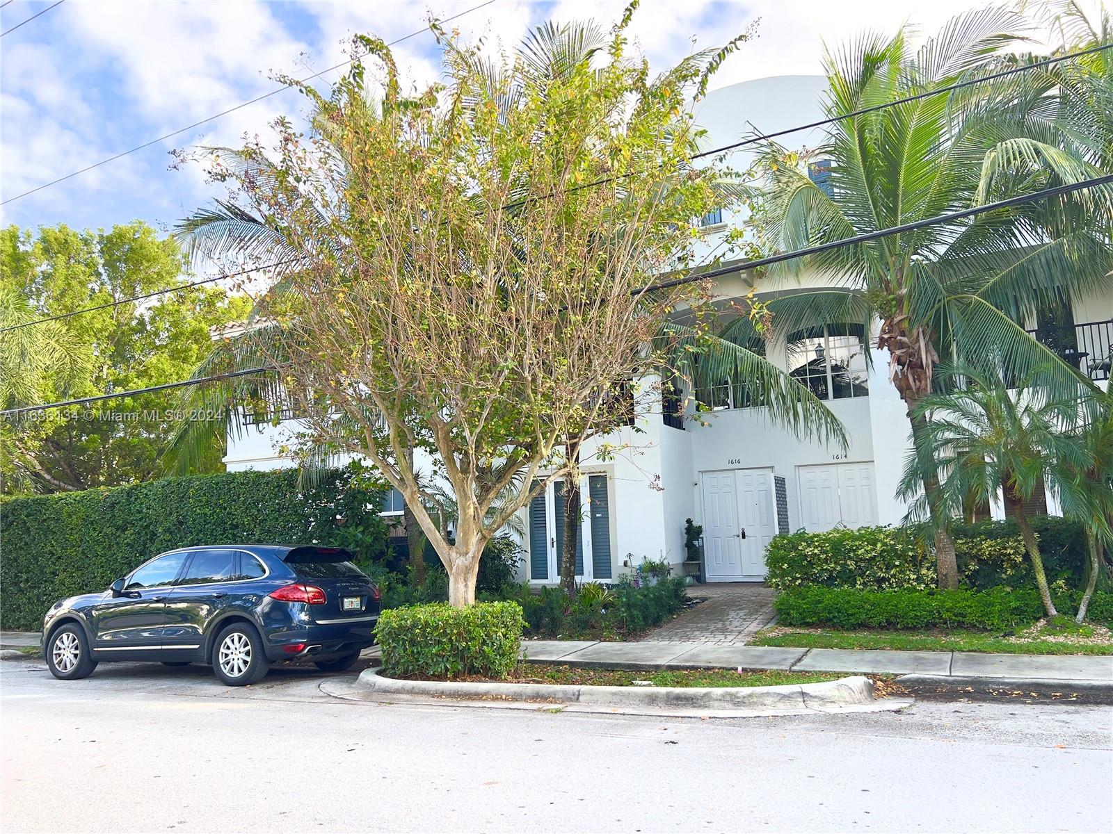 front view of a house with a garden