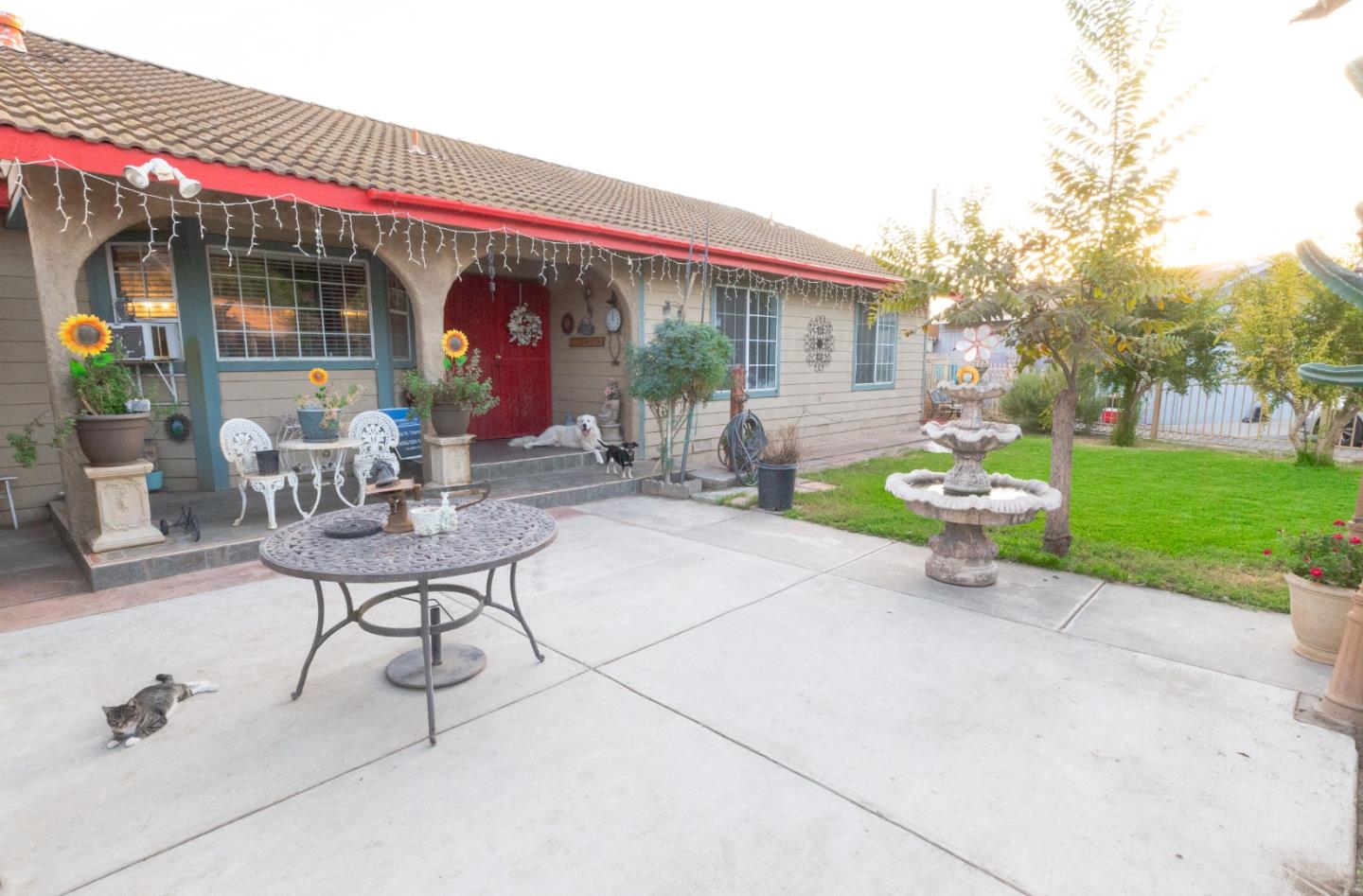 a view of a chairs and table in patio of a house