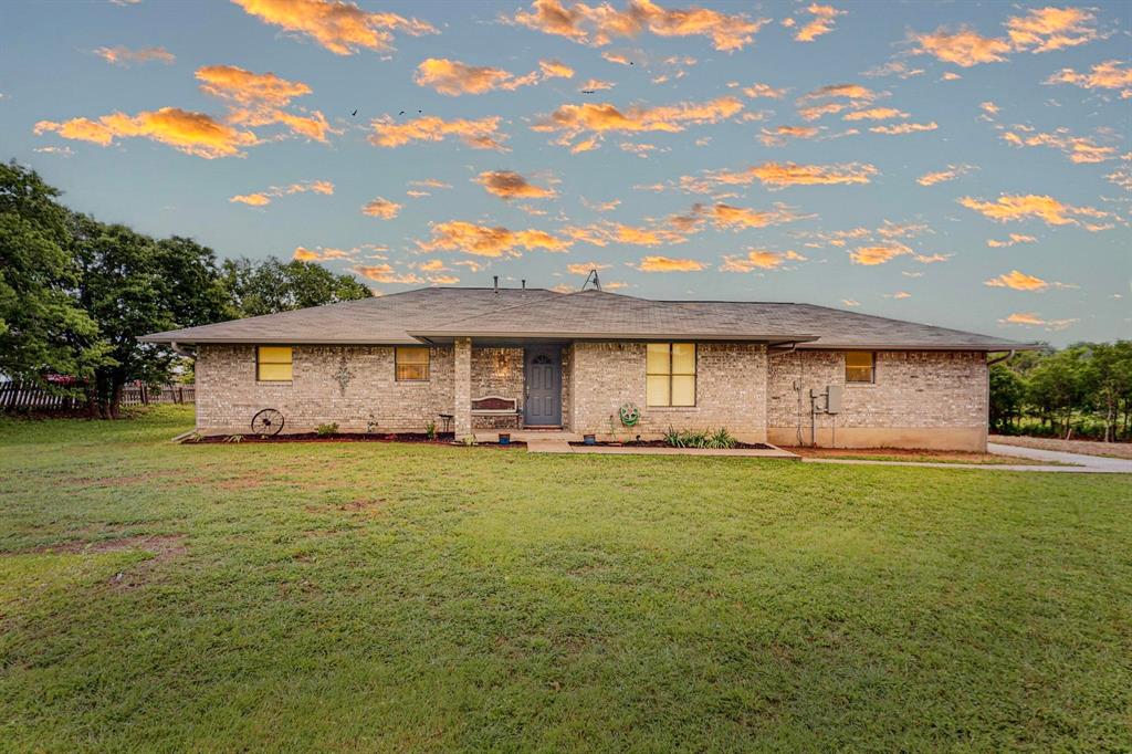 a front view of house with an outdoor space and seating