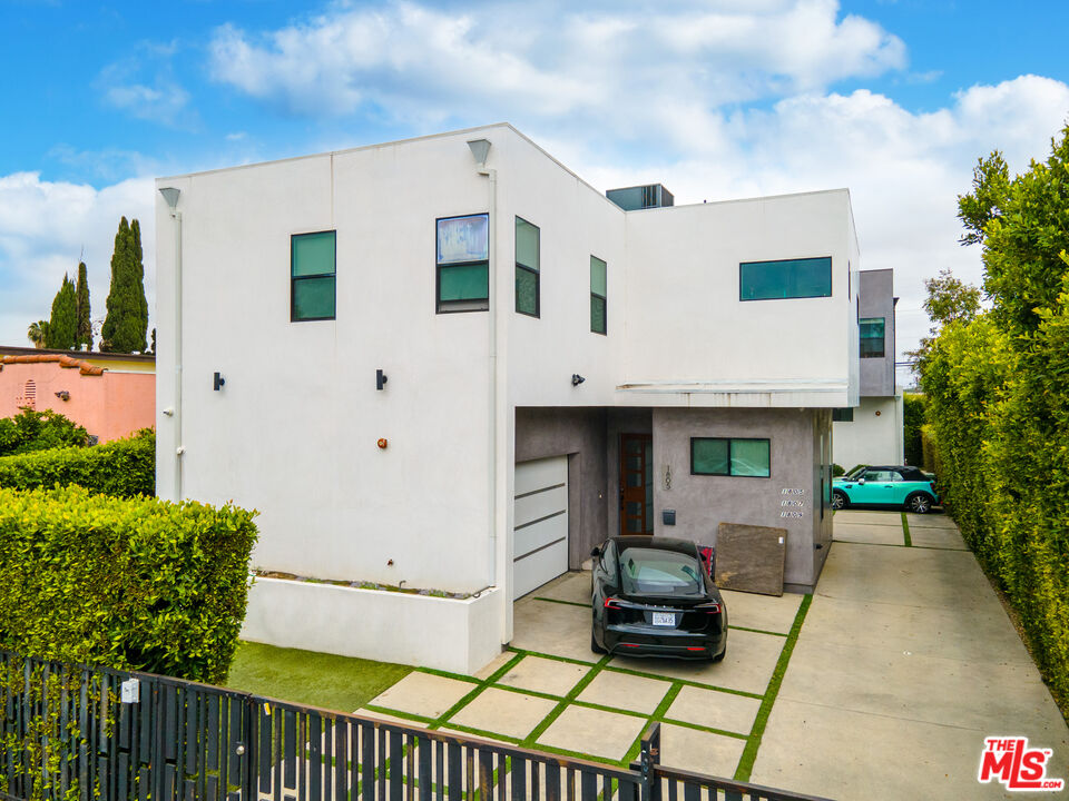 a front view of a house with sitting area