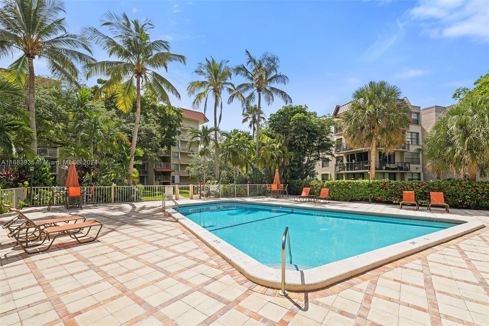 a view of a swimming pool with a lounge chairs