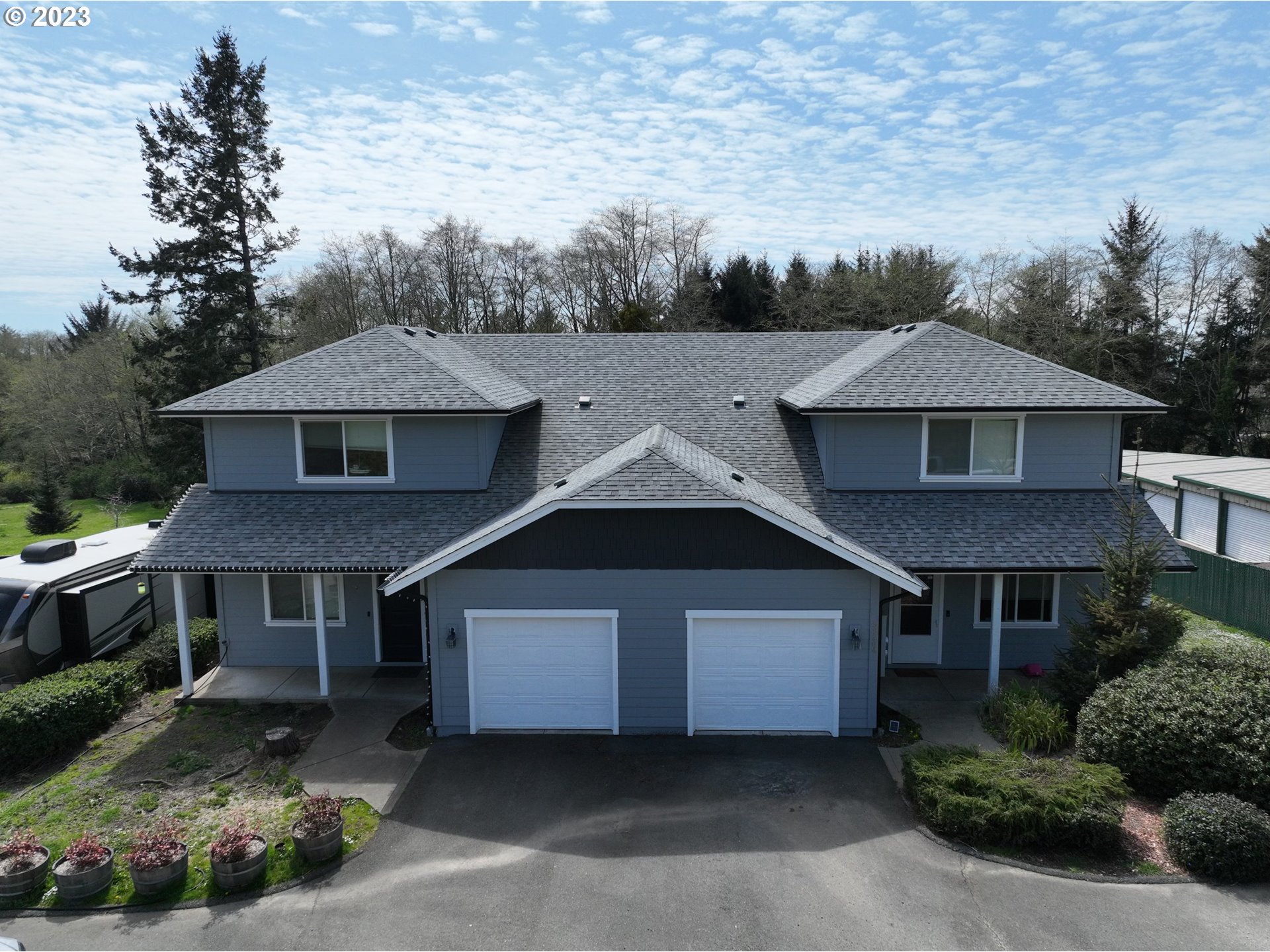 an aerial view of a house with a yard