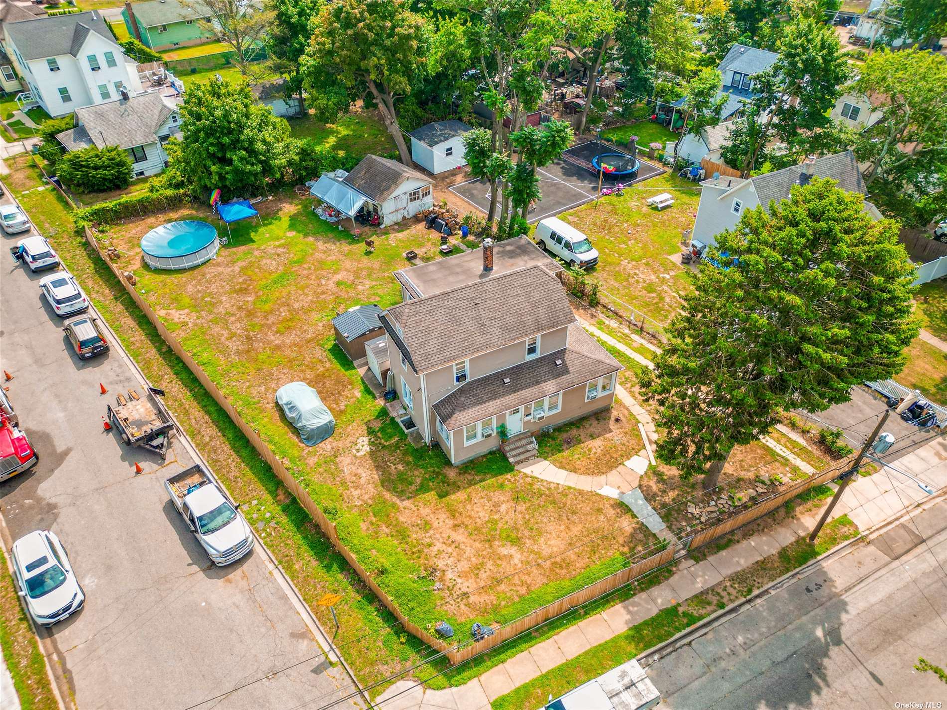 an aerial view of residential houses with outdoor space