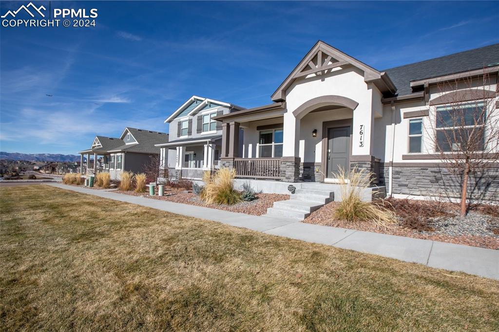 Craftsman-style Detached Single Family Home featuring Covered Front Porch