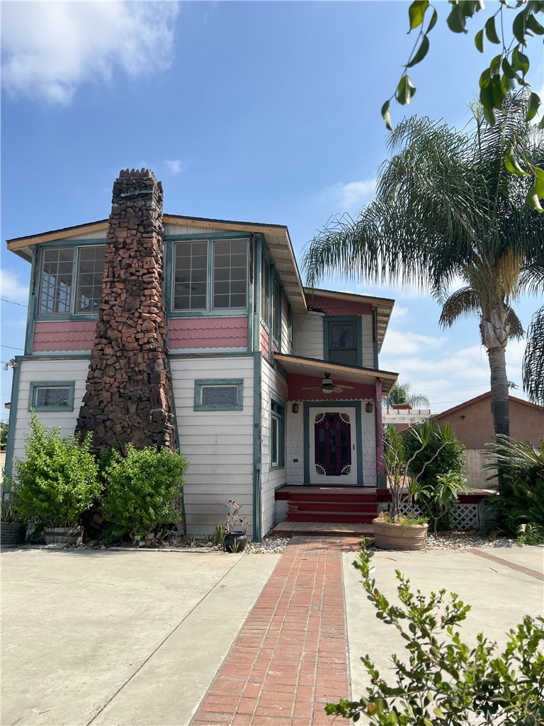 a front view of a house with garden