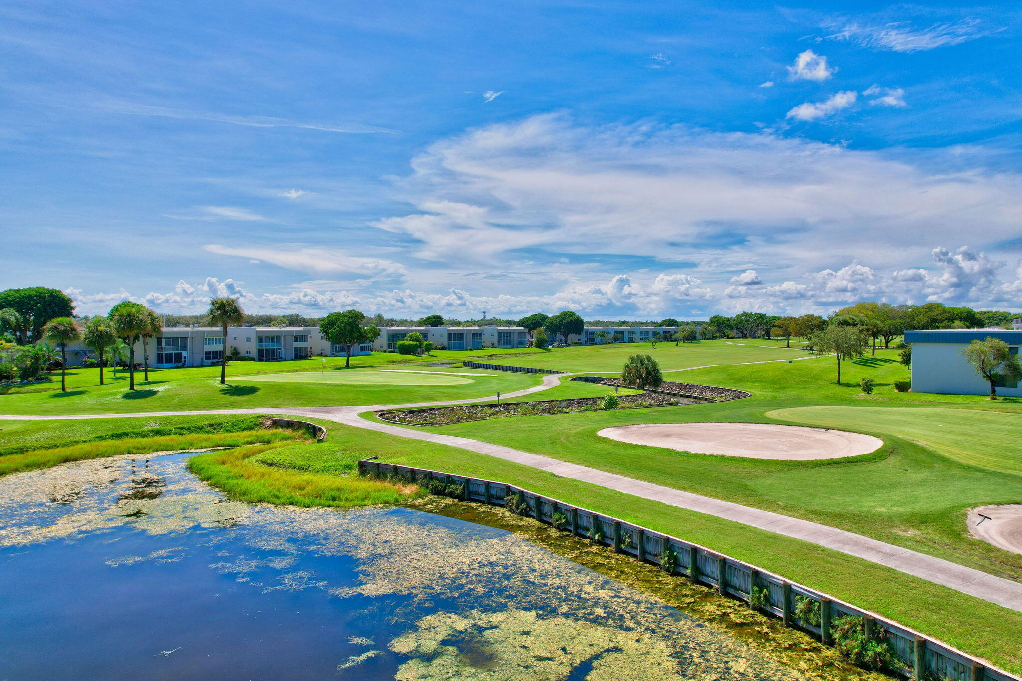 a view of a golf course with a lake