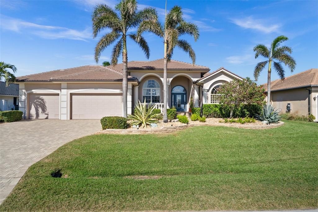 a front view of a house with garden