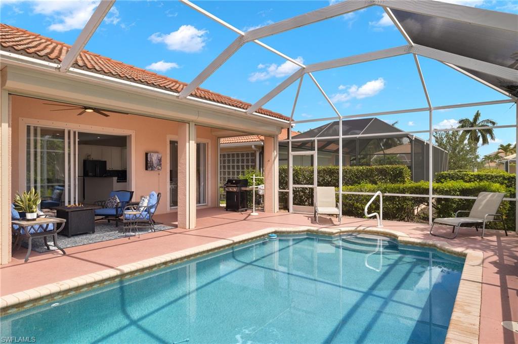 a swimming pool with outdoor seating and yard