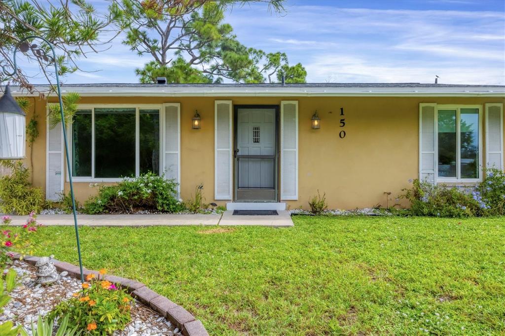 front view of a house with a yard