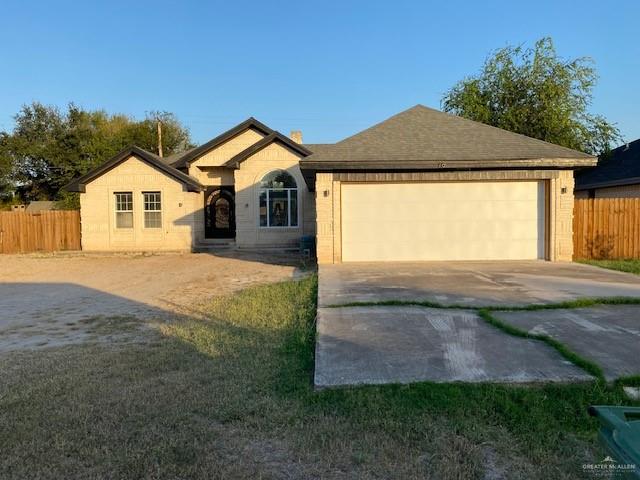 a front view of a house with yard