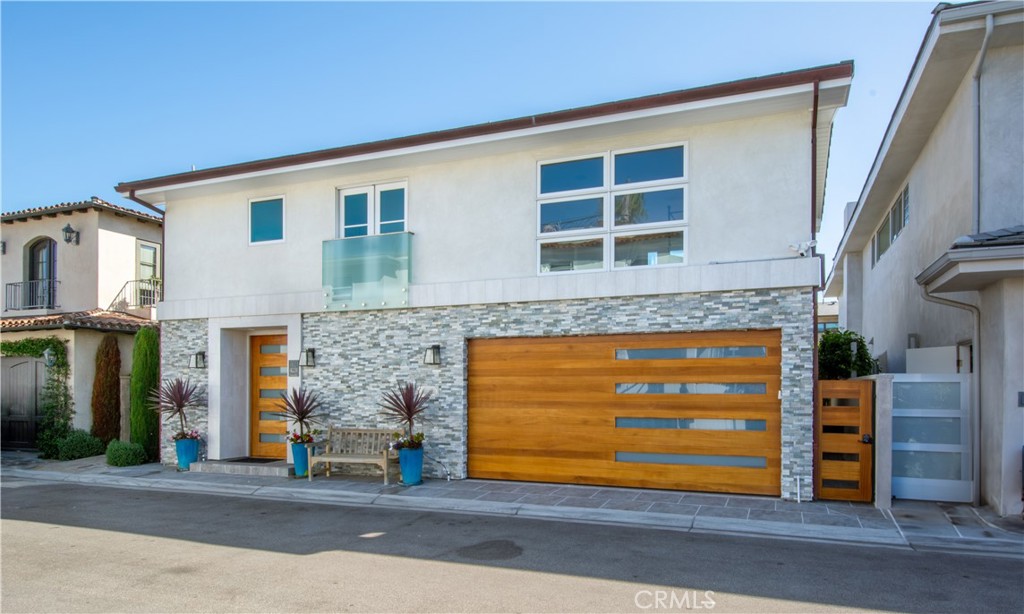 a front view of a house with a garage