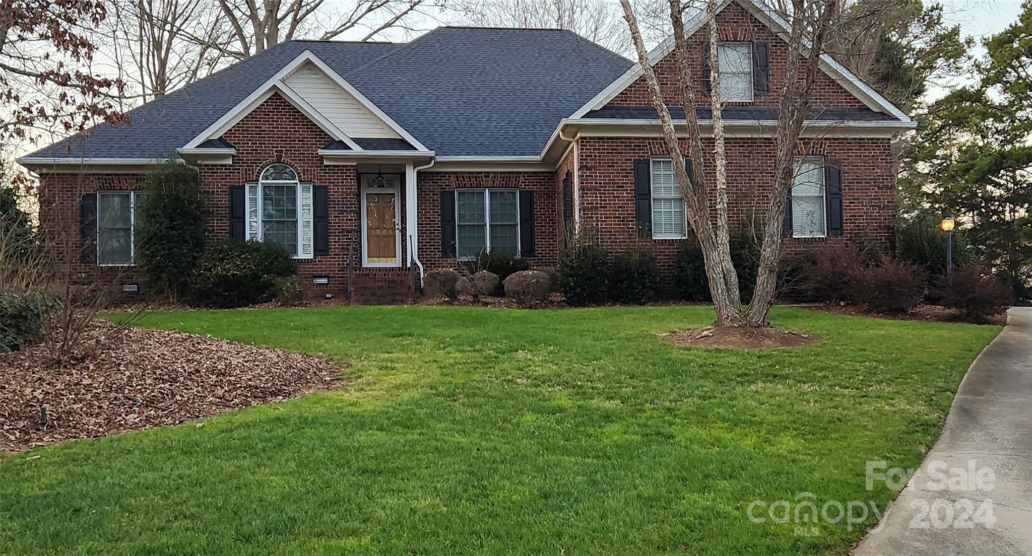 front view of a house with a yard