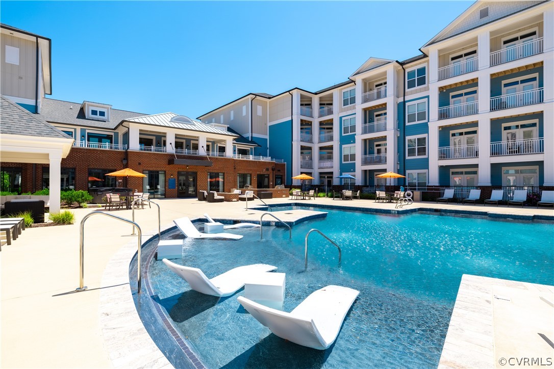 View of pool with a patio area