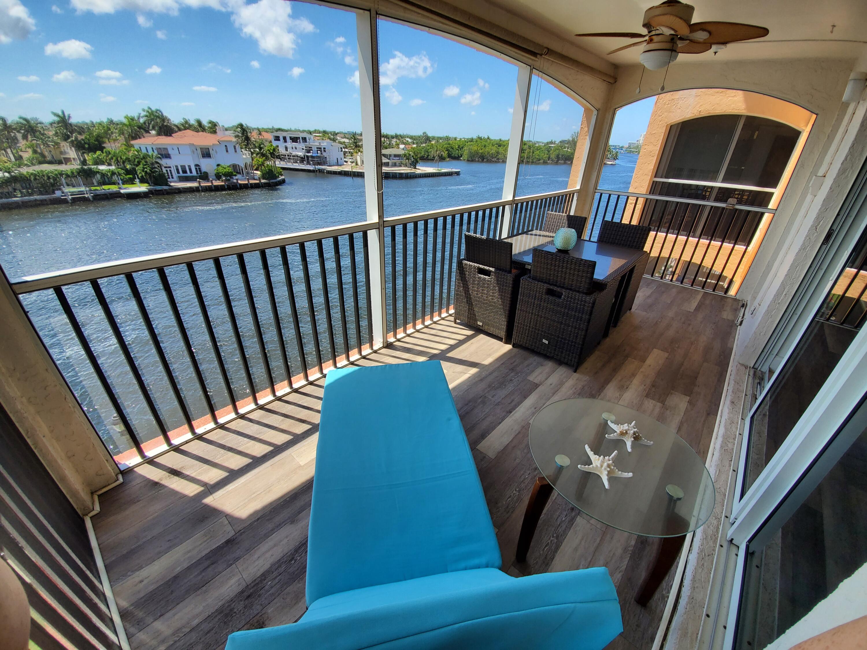 a view of balcony with furniture