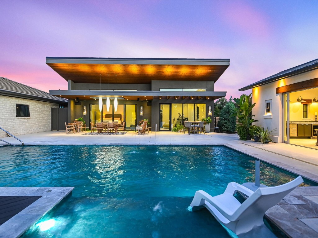 a swimming pool with outdoor seating