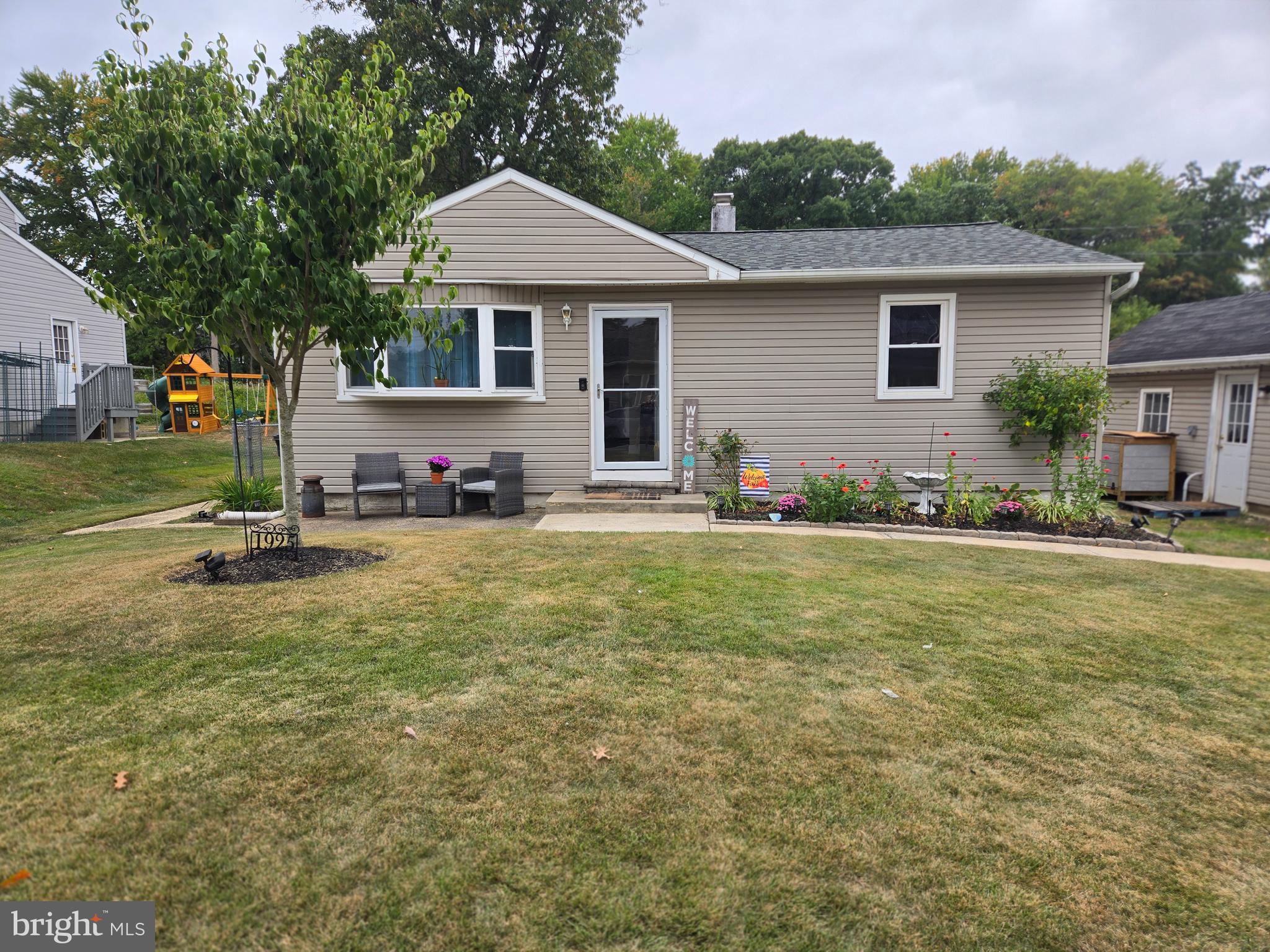 a front view of a house with a yard