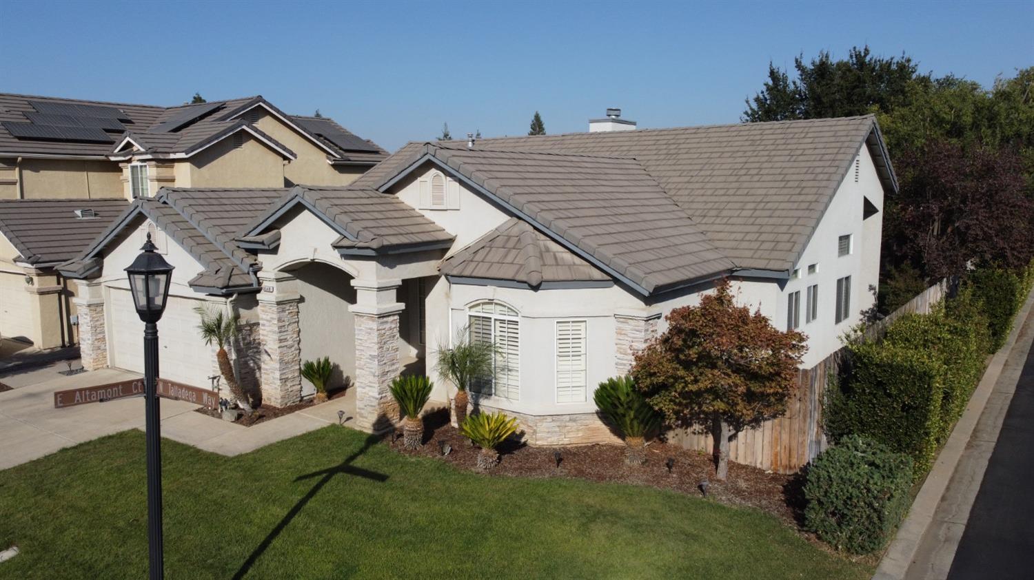 a view of house with yard