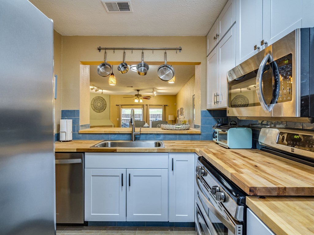 a kitchen with a sink and cabinets