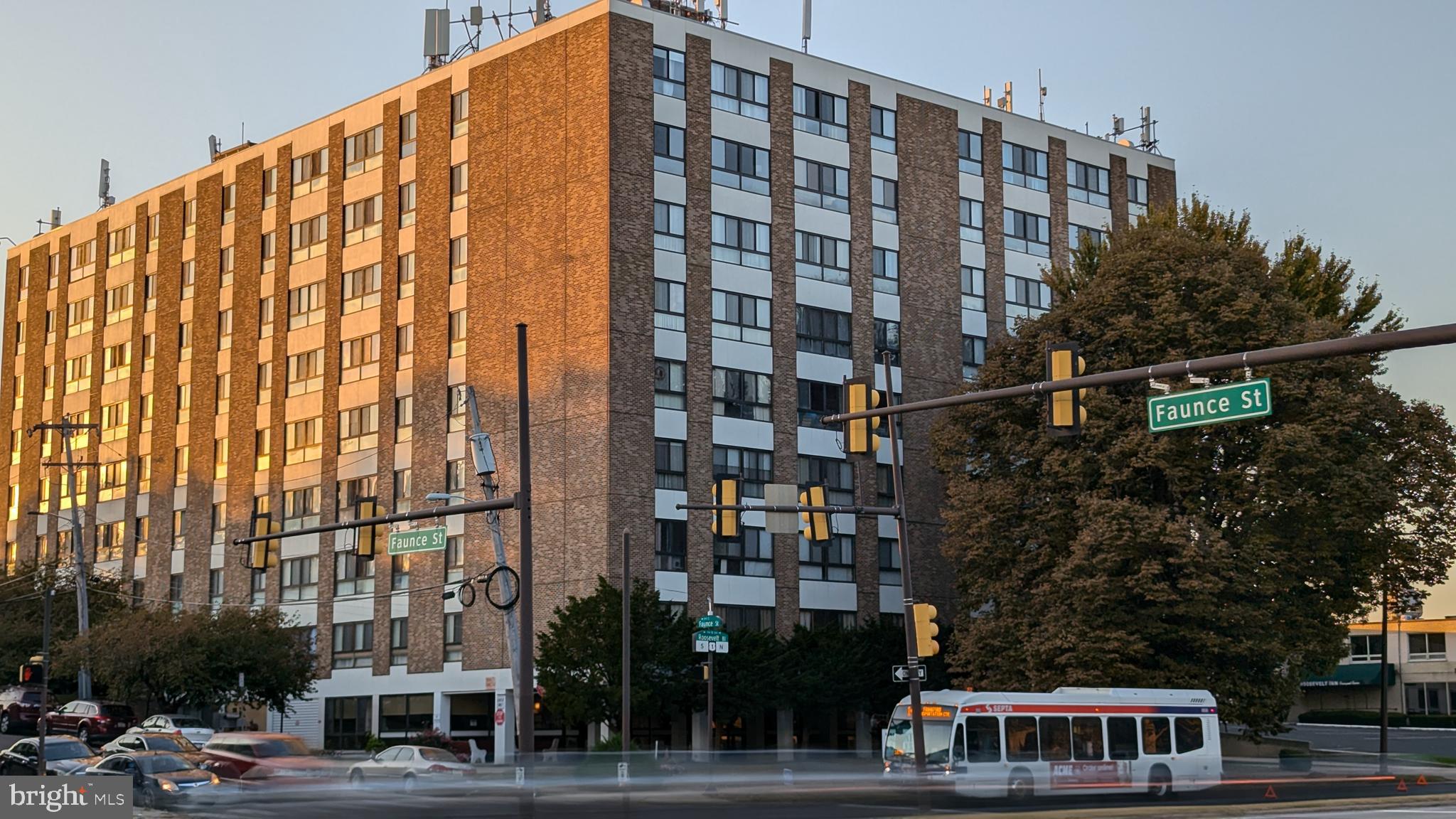 a view of a tall building in the street