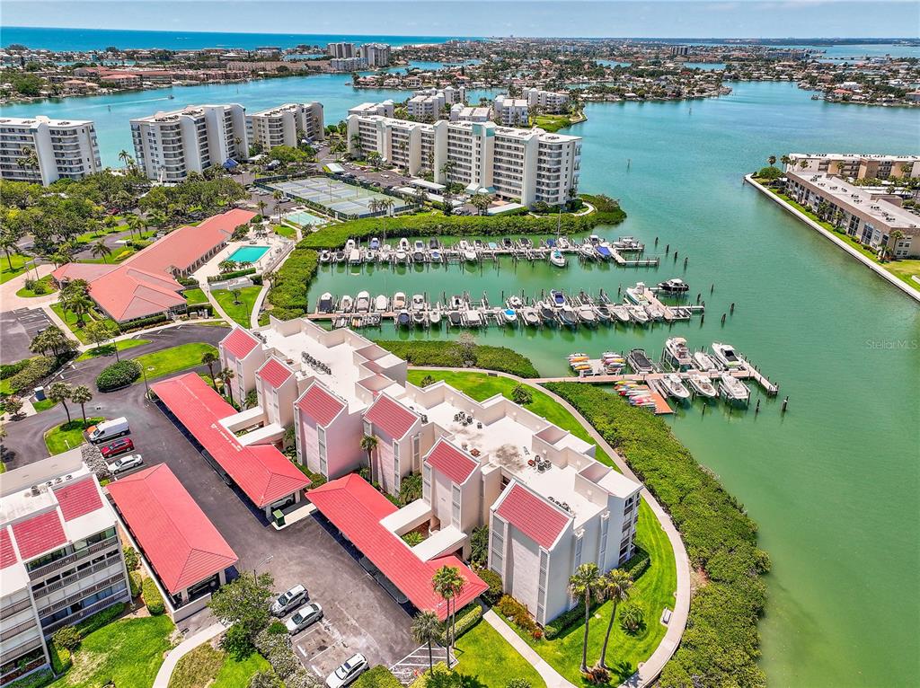 an aerial view of a swimming pool patio and lake view