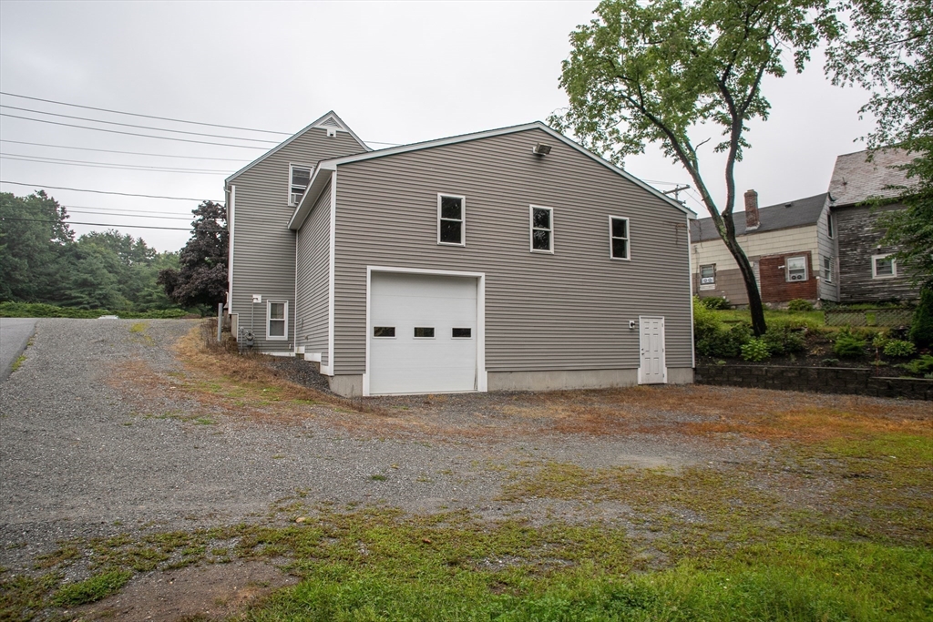 a view of a house with a backyard