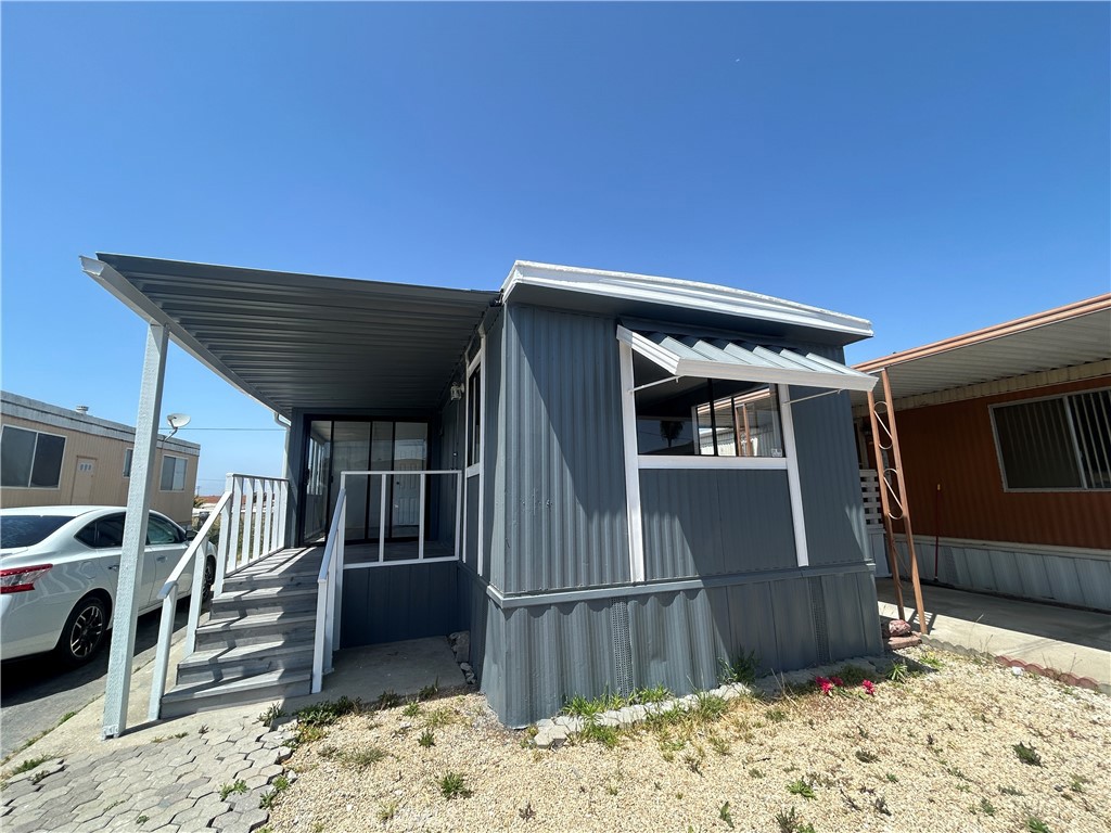 a view of a house with a wooden fence